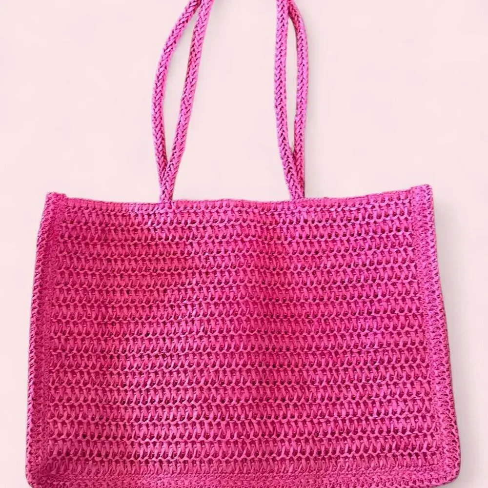 Pink Juicy Couture woven tote bag with braided handles
